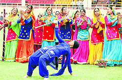 Schoolchildren perform the full dress rehearsal for the Independence Day function at Guru Gobind Singh Stadium in Jalandhar on Wednesday