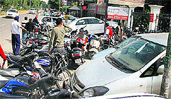 Vehicles parked in a haphazard manners outside a city hospital on the Mahavir Marg in Jalandhar