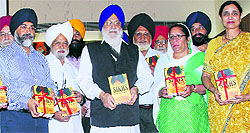 Avtar Singh Makkar, president, SGPC, releases the book Sikhs in World War I at Ramgarhia Girls College in Ludhiana on Wednesday