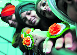 Students of the Sportking Institute of Fashion Technology wear Tricolour rings