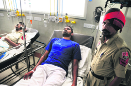 Injured policemen under treatment at a hospital in Ludhiana on Wednesday.