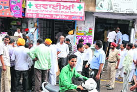 PRTC shops situated on the premises of the bus stand being vacated after the court orders in Bathinda on Friday.