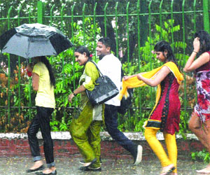Even as it was tipping down, some youngsters seemed to be enjoying themselves in New Delhi on Friday.