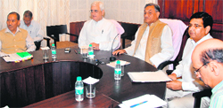 Foreign Minister Salman Khurshid along with Chief Minister Vijay Bahuguna holds a meeting to review the progress of disaster relief measures in Dehradun on Friday. A Tribune photograph