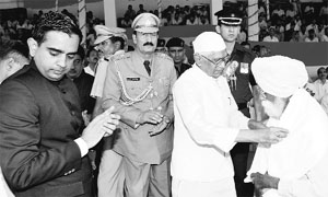 Governor Jagannath Pahadia honours a freedom fighter at the state-level Independence Day function in Kurukshetra on Thursday. 