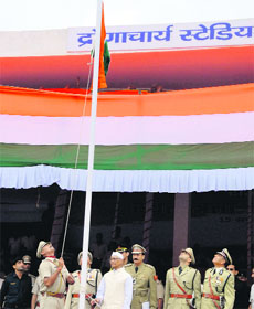 Governor Jagannath Pahadia unfurls the National Flag at the state-level Independence Day celebrations at Dronacharya Stadium, Kurukshetra, on Thursday. 