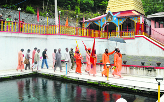 Saints, led by Mahant Deepinder Giri, carry the Charri Mubarak at the Martand Sun Temple in Anantnag district on Friday.