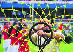 A student performs gatka during the Independence Day function at Guru Nanak Stadium in Ludhiana on Thursday. Tribune photo: Himanshu Mahajan