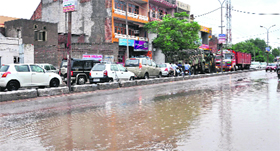 Vehicles ply in a single lane because of the poor condition of the road.