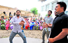 Ritual celebrations: Men sing and dance during the Teej celebrations at Jaipalgarh village in Bathinda on Saturday.