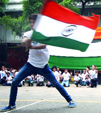 Underprivileged children in their own way try to raise funds for the Uttarakhand flood victims, at Jantar Mantar in New Delhi on Saturday.