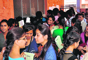 Students in front of the admission counter of Shravannath Math Jawaharlal Nehru College in Haridwar on Saturday.