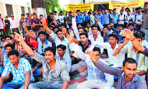 Students of Gurukul Kangri University protest at the administrative office of the Vice-Chancellor in support of their demands in Haridwar on Saturday. 