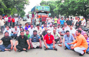 ABHSS activists block Phagwara-Nakodar road on Saturday evening. 