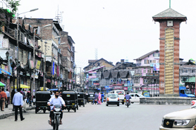 Light vehicles ply on Lal Chowk in Srinagar on Saturday.