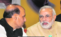 Gujarat CM Narendra Modi with the BJP national president Rajnath Singh in New Delhi on Saturday