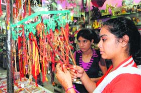 Girls look for best Rakhis for their brothers in Amritsar on Sunday