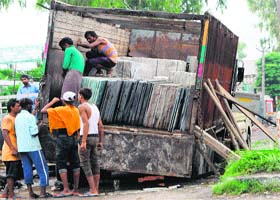 Doomed: A truck laden with marble sunk at the dug-out Airport Road in Amritsar on Sunday