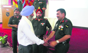 The GOC, Golden Arrow Division, greets a war veteran at Mamdot Hall in Ferozepur.