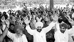 Members of the Sky Rock City Welfare Society hold a protest at Silvy Park, Phase X, in Mohali on Sunday