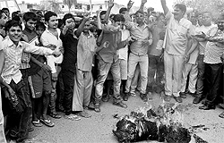 Residents of Hallo Majra burn an effigy of the area councillor, Janat Jahan,during a protest on Sunday
