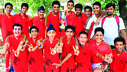 Members of St Johns School football team strike a pose after winning Br Meredith Football Tournament at Sector 26 in Chandigarh on Sunday
