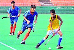 Players in action during a hockey match between Chandigarh and Malva Academy at Sector 42 in Chandigarh on Sunday