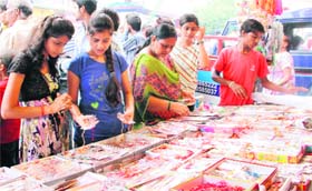 Girls buy rakhis for the forthcoming rakshabandhan festival in Dehradun on Sunday