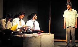 Artistes enact a scene from the play Zameen Ka Sawal in Jammu on Sunday