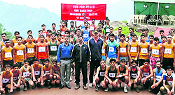 Army officers along with winners of the mini marathon in Mahore on Sunday
