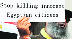 A protester displays a banner in front of the Egyptian embassy in Tokyo 