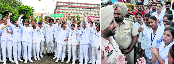 Students of Adesh Nursing College protest against the university management; (right) police personnel try to pacify the agitating students.