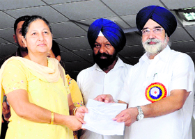 Education Minister of Punjab Sikander Singh Maluka gives away recognition certificates to affiliated schools which met the Right to Education Act parameters, in Bathinda on Monday.