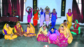 Students of Dashmesh Girls College of Education perform at a function in college.