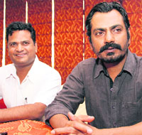 Actor Nawazuddin Siddiqui talks to mediapersons in Dehradun on Monday. 