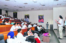 Dr Kuldeep Singh of World Health Organisation delivers the inaugural address during a one-day workshop on 'Watch on Polio and Eczema' at Women Medical College, Khanpur Kalan.