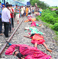 Bodies lie along the tracks after a train ploughed into a crowd of pilgrims at the Dhamara Ghat railway station.  AFP