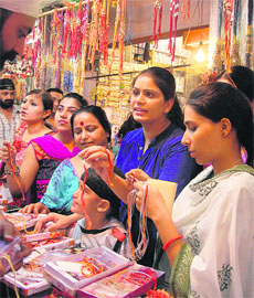 Women buy rakhis on the eve of Rakshabandhan at Meena Bazaar in Jalandhar on Monday.