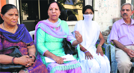 Social activists along with the molestation victim in Ludhiana on Monday.