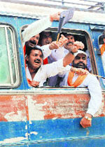 Rashtriyavadi Shiv Sena activists shout slogans after being taken into preventive custody in Amritsar on Monday.