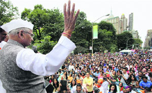 Social activist Anna Hazare addresses the crowd at India Day parade in New York on Sunday. 