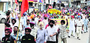 Members of various organisations hold a protest march in the city on Tuesday. 