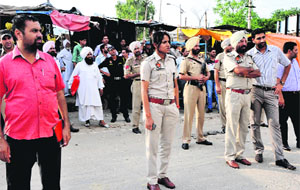Assistant Superintendent of Police Alka Meena and other civil and police officials oversee the anti-encroachment drive on the waqf Board land in Bathinda on Tuesday. 