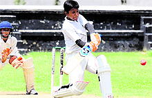 A batsman plays a sweep shot during a cricket match at S Josephs Senior Secondary School at Sector 44 in Chandigarh on Tuesday