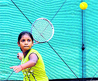 Snitabithi in action during a tennis match a Manav Mangal School in Panchkula on Tuesday