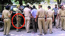 The police with the impounded car and the seized iron rod (encircled) at Panjab University, Chandigarh, on Tuesday