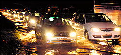 Commuters stuck in a traffic jam due to rain in Chandigarh on Tuesday