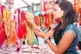 A girl buys rakhi at Paltan Bazaar in Dehrdaun on Tuesday.