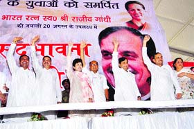 Congress leaders wave to the crowd during a rally in Jind on Tuesday