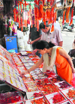 A woman looks at a rakhi at a shop in Jammu on Tuesday. Tribune Photo: Inderjeet Singh 